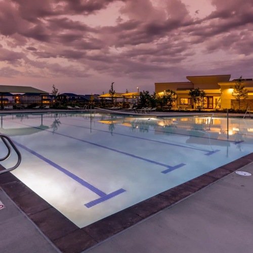 a pool with a building in the background
