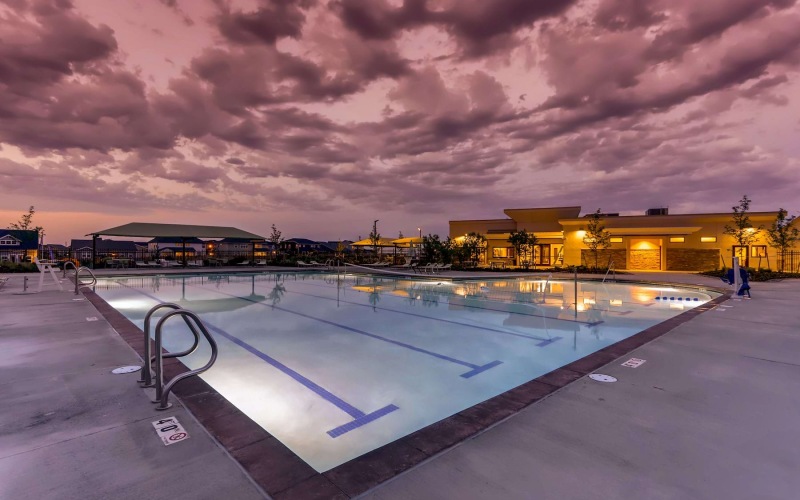 a pool with a building in the background