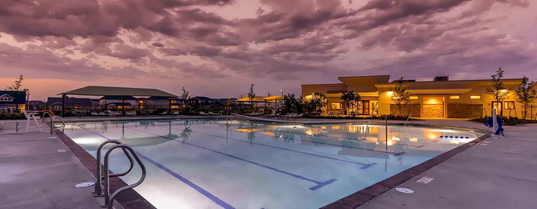 a pool with a building in the background
