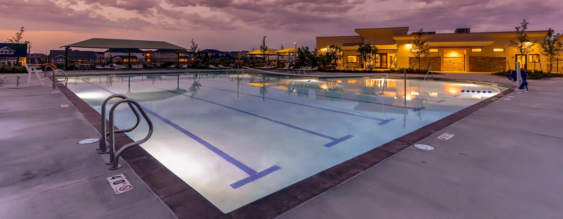 a pool with a building in the background