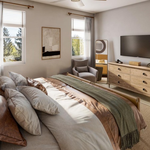 a bedroom with a bed and a tv