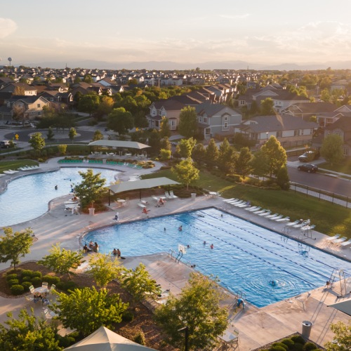 a pool with a building in the background