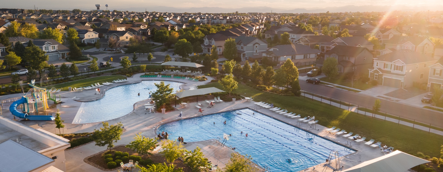 a pool with a building in the background