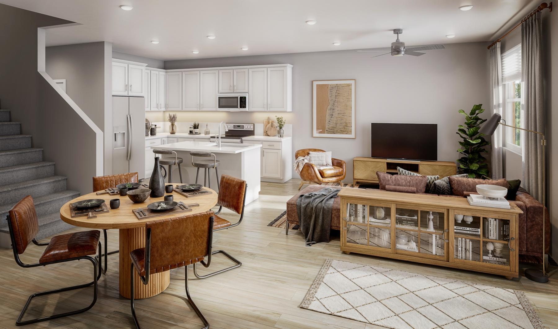 a kitchen and living room, couch, table and chairs